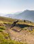 Mountain biker riding on winding trail in mountainous landscape