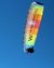 Colorful paraglider with Winkler Hotels advertisement against clear blue sky