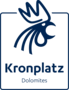 Kronplatz-Dolomites-Logo mit dunkelblauem Emblem