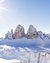 Snow-covered Dolomite peaks under bright sun