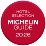 Badge rotondo rosso con la scritta Hotel Selection Michelin Guide 2026