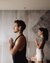 Two people practicing yoga in a calm indoor space