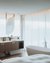 Modern bathroom with freestanding bathtub and double sinks