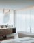 Bagno moderno con vasca freestanding e doppio lavabo